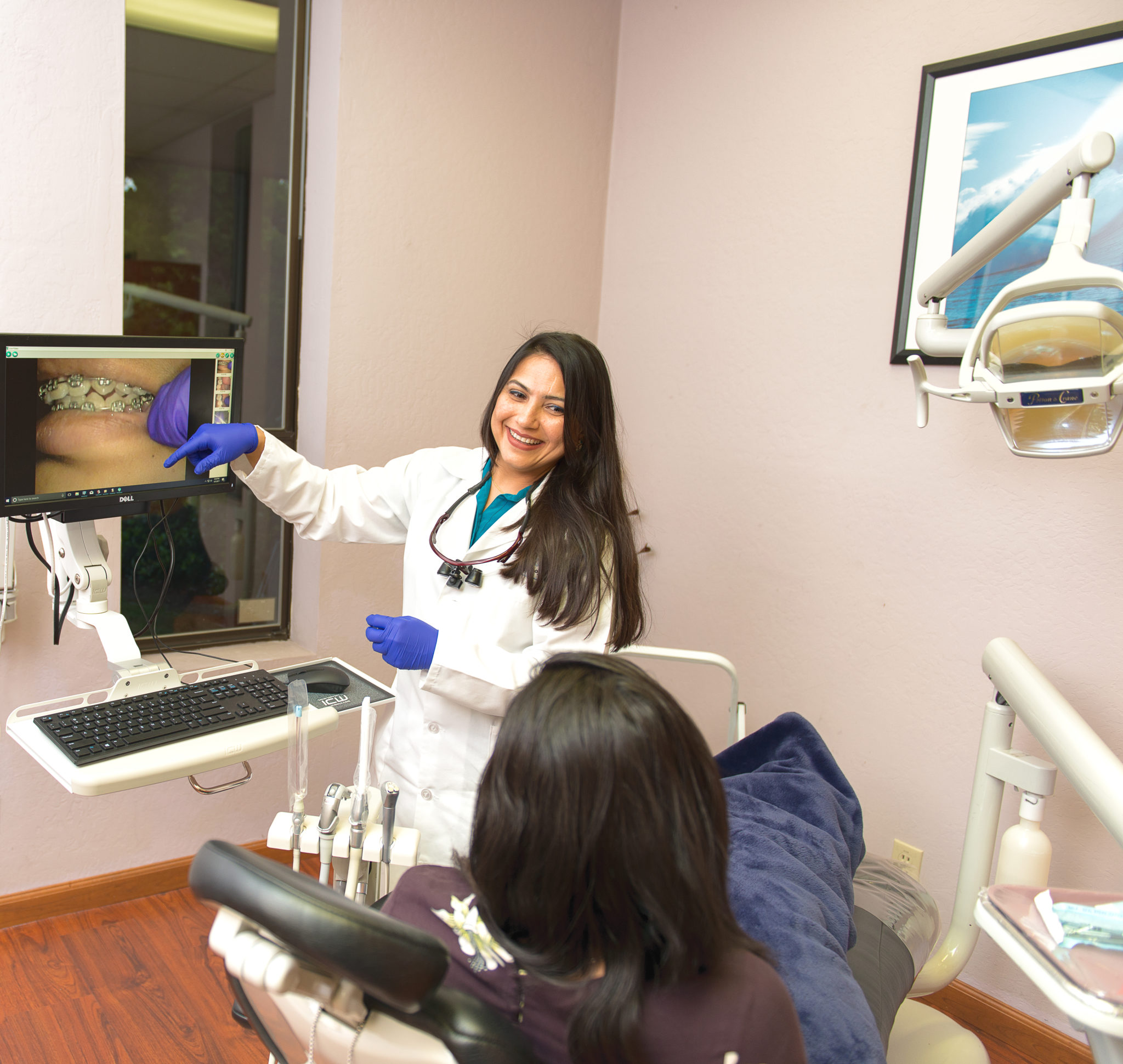 Dr. Saboowala explaining a dental procedure to her patient 10